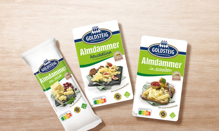 La gamma Almdammer di GOLDSTEIG su un tavolo di legno
